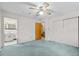This bedroom features a ceiling fan, a double door closet, and an adjacent bathroom at 4018 Moon Lindley Rd, Snow Camp, NC 27349