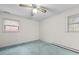 This bedroom features two windows, and plain walls and trim at 4018 Moon Lindley Rd, Snow Camp, NC 27349