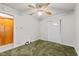 This bedroom features a ceiling fan, a double door closet, and an adjacent door at 4018 Moon Lindley Rd, Snow Camp, NC 27349