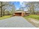 Home with a large covered carport and a well-kept gravel driveway at 4018 Moon Lindley Rd, Snow Camp, NC 27349