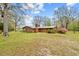 Brick home with a large backyard featuring mature trees and plenty of open space at 4018 Moon Lindley Rd, Snow Camp, NC 27349