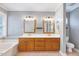 Bathroom boasts double sinks with wood cabinets, tile flooring, and a separate tub at 413 Correy Pl, Clayton, NC 27520