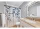 Bathroom with granite vanity, floral shower curtain, and neutral wall color at 413 Correy Pl, Clayton, NC 27520