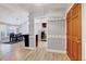 Open entryway showcasing the spacious layout, wood floors, and access to the kitchen and dining areas at 413 Correy Pl, Clayton, NC 27520