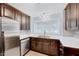 Bright kitchen with stainless steel appliances, ample counter space, and well-maintained cabinetry at 413 Correy Pl, Clayton, NC 27520
