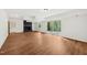 Finished basement with vinyl floors, brick fireplace, and sliding glass doors to the outside at 4815 Oak Park Rd, Raleigh, NC 27612