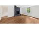 Basement with white walls, fireplace and wood flooring at 4815 Oak Park Rd, Raleigh, NC 27612