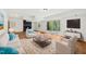 Staged basement with vinyl floors, brick fireplace, sliding glass doors, and a media center at 4815 Oak Park Rd, Raleigh, NC 27612