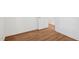 Bedroom featuring wood floors and a door, perfect for a minimalist design at 4815 Oak Park Rd, Raleigh, NC 27612