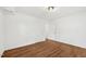 Bedroom featuring wood floors and 2 doors at 4815 Oak Park Rd, Raleigh, NC 27612