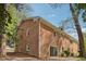 Brick home featuring two stories and a sliding glass door on the first floor at 4815 Oak Park Rd, Raleigh, NC 27612