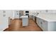 Modern kitchen featuring white cabinets, a kitchen island, and stainless steel appliances at 4815 Oak Park Rd, Raleigh, NC 27612