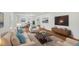 Bright living room featuring stylish furnishings, hardwood floors, and a modern aesthetic at 4815 Oak Park Rd, Raleigh, NC 27612