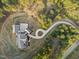 Aerial view of a custom home showcasing its circular driveway and private lot at 482 Emily Ln, Chapel Hill, NC 27516