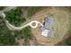 Overhead view of a large house with a circular driveway, surrounded by lush trees and landscaping at 482 Emily Ln, Chapel Hill, NC 27516