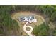 Spacious white farmhouse with gray roof, surrounded by mature trees and a long driveway at 482 Emily Ln, Chapel Hill, NC 27516