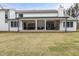 Expansive backyard featuring a covered patio area for outdoor entertaining at 482 Emily Ln, Chapel Hill, NC 27516
