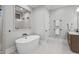 Bright bathroom featuring a modern standalone tub and a glimpse into the tiled shower at 482 Emily Ln, Chapel Hill, NC 27516