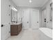 Bathroom with single sink vanity, granite countertops and view to modern tub and tiled shower at 482 Emily Ln, Chapel Hill, NC 27516