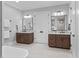Bathroom with double sink vanities and granite countertops, plus a glimpse of the modern tub at 482 Emily Ln, Chapel Hill, NC 27516