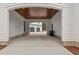 Covered breezeway featuring wood ceiling and brick column bases connecting garage to main house at 482 Emily Ln, Chapel Hill, NC 27516