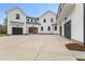 Modern farmhouse style home with black trim, white board and batten, plus large driveway at 482 Emily Ln, Chapel Hill, NC 27516