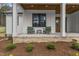 Charming front porch features comfortable seating and beautiful landscaping at 482 Emily Ln, Chapel Hill, NC 27516
