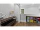 Hallway with a wooden console table, table lamp, and nearby toys and storage at 482 Emily Ln, Chapel Hill, NC 27516