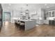 Bright kitchen features a large quartz island, white cabinets, and hardwood floors at 482 Emily Ln, Chapel Hill, NC 27516