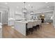 Open kitchen with expansive island, modern appliances, and adjacent living area at 482 Emily Ln, Chapel Hill, NC 27516