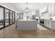 Bright, open kitchen with large island, modern appliances, and outdoor access at 482 Emily Ln, Chapel Hill, NC 27516
