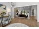 Open-concept living area with hardwood floors, fireplace, and seamless flow to outdoors at 482 Emily Ln, Chapel Hill, NC 27516