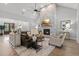 Cozy living room features a stone fireplace, hardwood floors, and comfortable seating at 482 Emily Ln, Chapel Hill, NC 27516