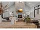 Bright living room featuring a stone fireplace, hardwood floors, and stylish decor at 482 Emily Ln, Chapel Hill, NC 27516