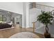 Living area featuring high ceilings, hardwood floors, fireplace, and staircase at 482 Emily Ln, Chapel Hill, NC 27516
