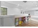 Upstairs loft area with a shelf full of toys, neutral walls, and wood floors at 482 Emily Ln, Chapel Hill, NC 27516