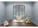 Office space featuring a dark wood desk with decorative items and natural light at 482 Emily Ln, Chapel Hill, NC 27516