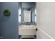 Stylish powder room features sleek floating vanity with an elegant mirror and modern fixtures at 482 Emily Ln, Chapel Hill, NC 27516