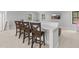 Recreation room features bar seating with leather chairs and a cozy leather sofa at 482 Emily Ln, Chapel Hill, NC 27516