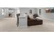 Comfortable recreation room with bar seating, a leather couch, and plenty of natural light at 482 Emily Ln, Chapel Hill, NC 27516