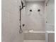 Walk-in shower featuring a bench and multiple shower heads in a beautifully tiled space at 482 Emily Ln, Chapel Hill, NC 27516