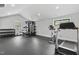 Spacious home gym with weightlifting equipment and large windows for natural light at 482 Emily Ln, Chapel Hill, NC 27516