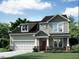 Charming two-story home with a welcoming front porch, complemented by well-manicured landscaping and a two-car garage at 5025 Aged Pine Rd # 56, Apex, NC 27523