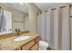 Well-lit bathroom features a vanity with a granite countertop and shower with curtain at 520 Brier Crossings Loop, Durham, NC 27703