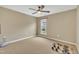 Empty bedroom with neutral carpet, natural light, and a fan with light fixture at 520 Brier Crossings Loop, Durham, NC 27703