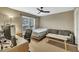 Bedroom featuring a ceiling fan, window, desk, sofa and bed at 520 Brier Crossings Loop, Durham, NC 27703