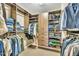 Walk-in closet with custom shelving and hanging racks for maximum storage at 520 Brier Crossings Loop, Durham, NC 27703