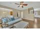 Open-concept living area with hardwood floors, comfortable sofa, and seamless transition to dining at 520 Brier Crossings Loop, Durham, NC 27703
