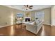 Stylish living room with hardwood floors, a sleek fireplace, and ample natural light at 520 Brier Crossings Loop, Durham, NC 27703
