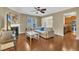 This cozy living room features hardwood floors, a fireplace, and ample natural light from the window and open doorway at 520 Brier Crossings Loop, Durham, NC 27703